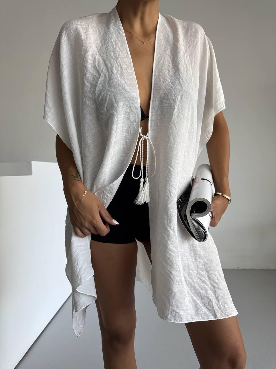 Beach kimono cape in lightweight fabric with deep V neckline and tassel ties