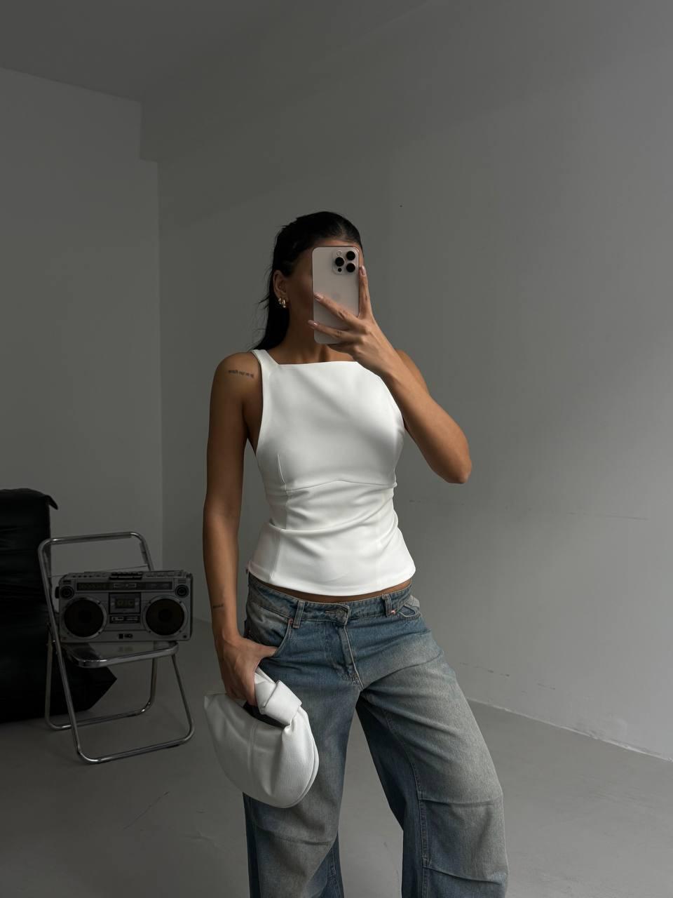 A fitted top with a square neckline and ties at the back